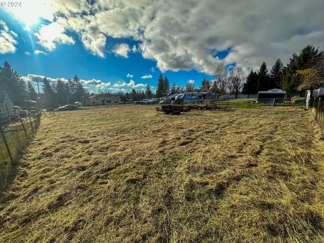 a view of a yard with an outdoor seating