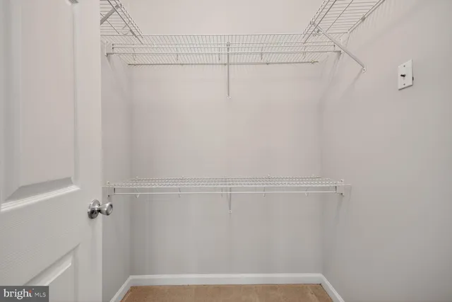 a view of a room with racks on the wall