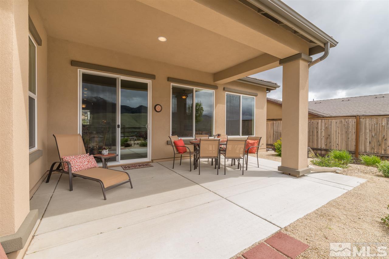 1255 Wakefield Trail Reno, NV 89523 - Photo 11 of 25 a living room with patio furniture and a garden