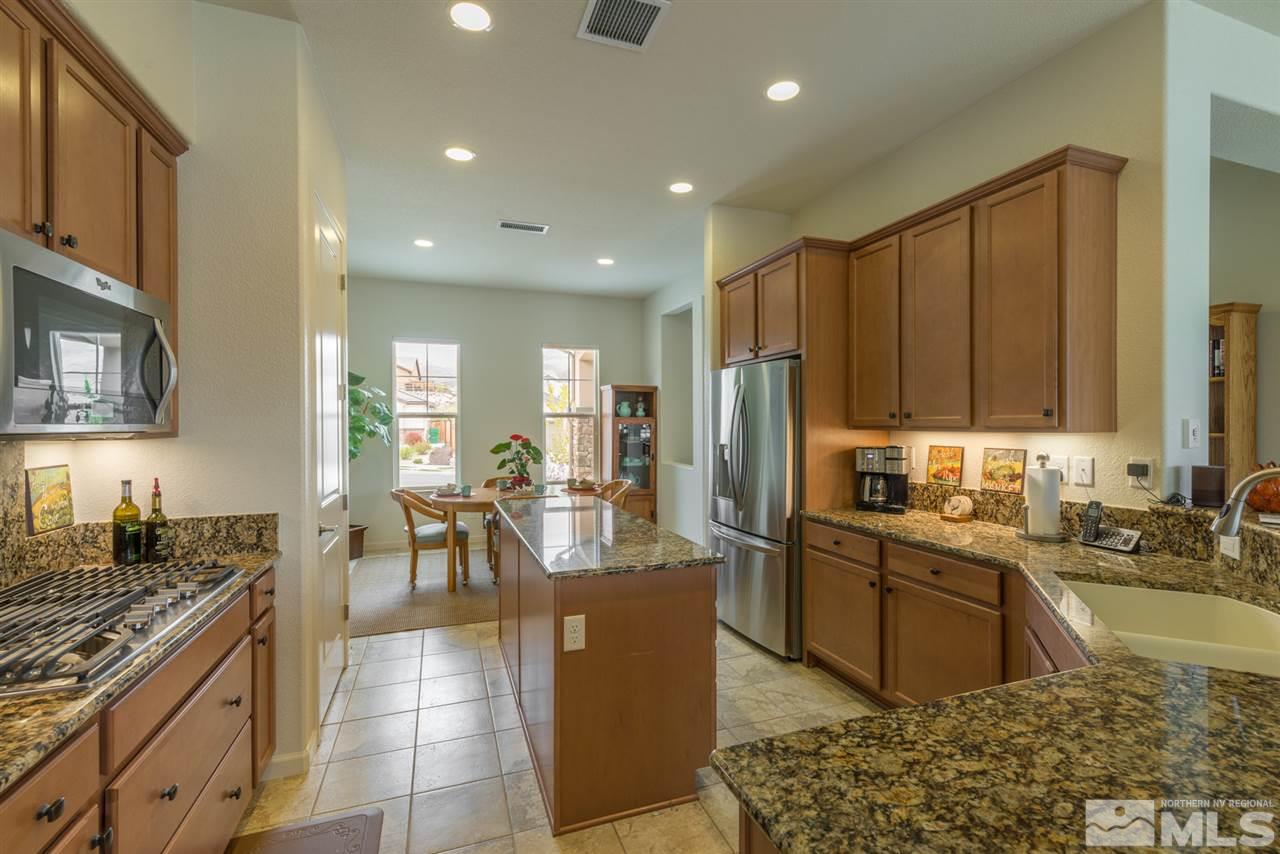 1255 Wakefield Trail Reno, NV 89523 - Photo 12 of 25 a large kitchen with lots of counter top space and stainless steel appliances