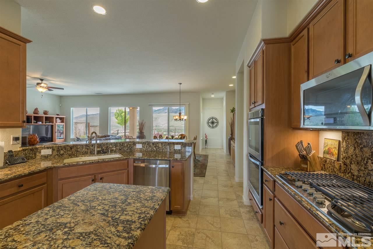 1255 Wakefield Trail Reno, NV 89523 - Photo 13 of 25 a kitchen with lots of counter top space and stainless steel appliances