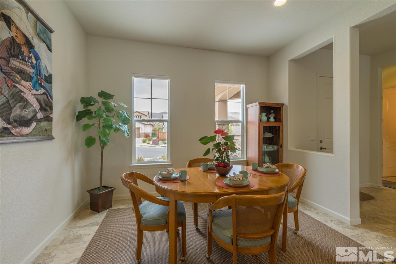 1255 Wakefield Trail Reno, NV 89523 - Photo 14 of 25 a dining room with furniture and potted plant