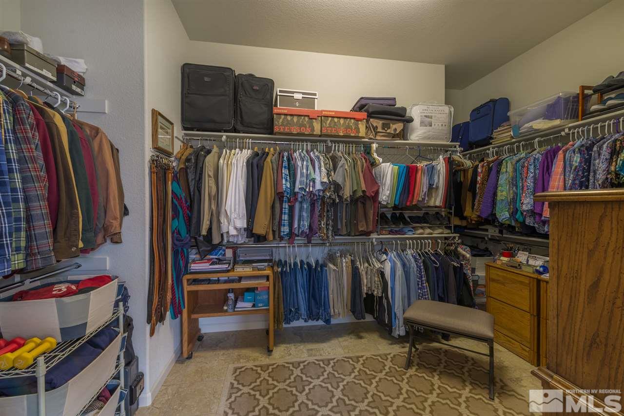 1255 Wakefield Trail Reno, NV 89523 - Photo 18 of 25 a view of walk in closet with clothes and shoes