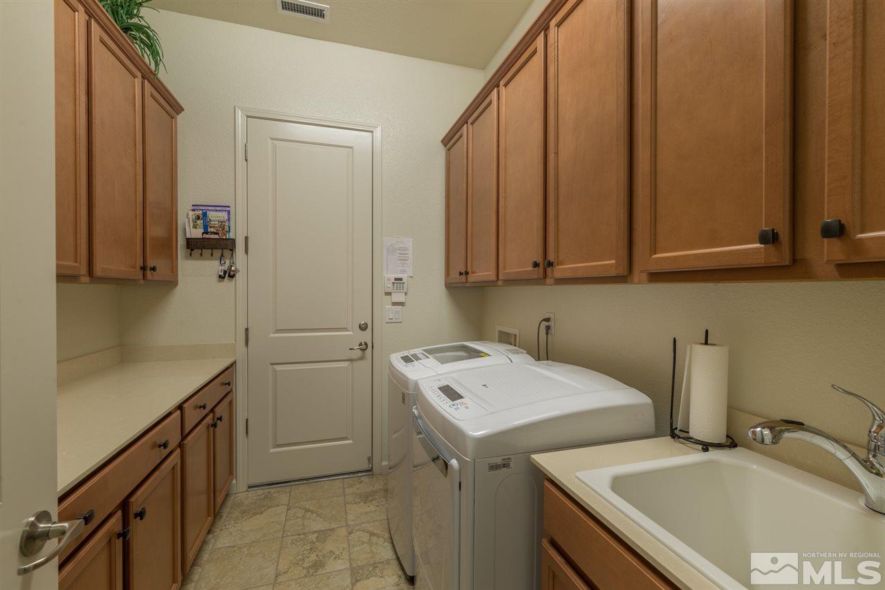 1255 Wakefield Trail Reno, NV 89523 - Photo 22 of 25 a utility room with sink dryer and washer