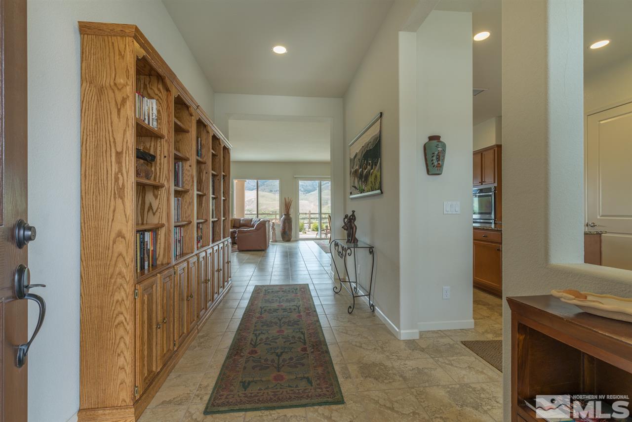 1255 Wakefield Trail Reno, NV 89523 - Photo 5 of 25 a view of a hallway view with living room and wooden floor