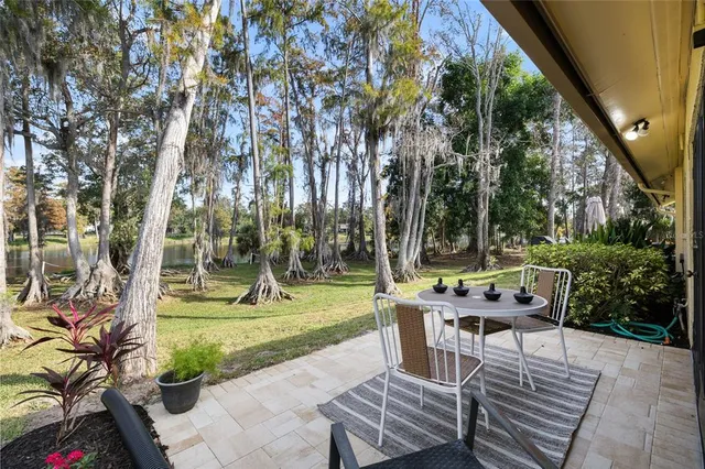 a view of a backyard with sitting area