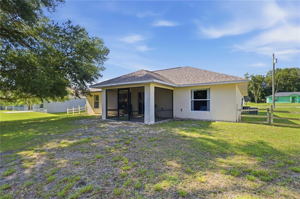 3959 Southwest 129th Street Ocala, FL 34473 - Photo 22 of 27 a front view of a house with a garden