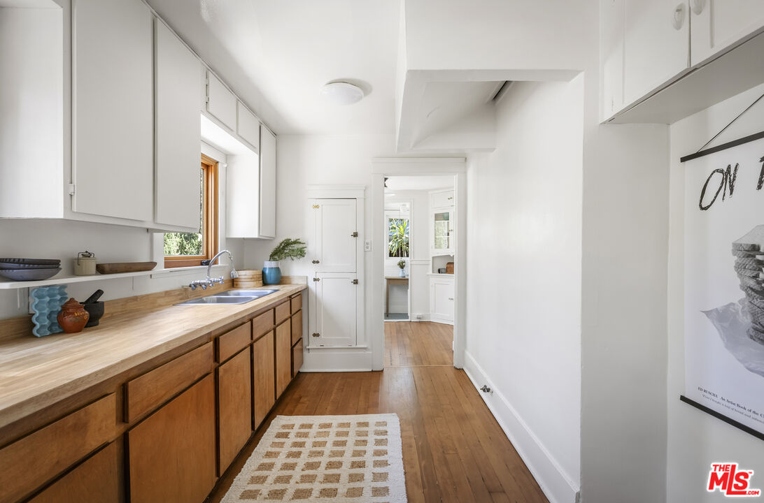 3865 Brunswick Avenue Los Angeles, CA 90039 - Photo 12 of 44 a kitchen with a sink and a refrigerator