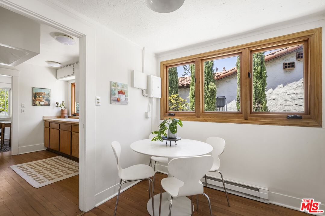 3865 Brunswick Avenue Los Angeles, CA 90039 - Photo 16 of 44 a view of a dining room with furniture window and wooden floor