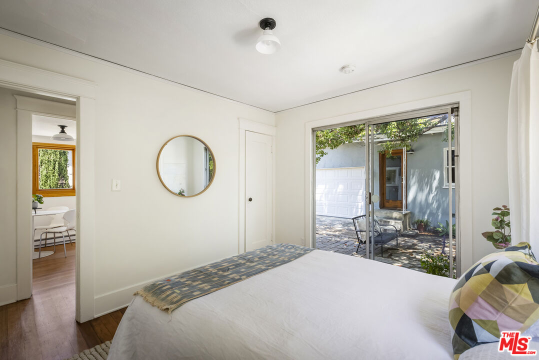 3865 Brunswick Avenue Los Angeles, CA 90039 - Photo 21 of 44 a bedroom with bed and a mirror