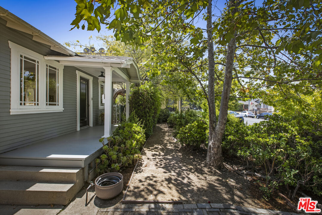 3865 Brunswick Avenue Los Angeles, CA 90039 - Photo 3 of 44 a view of a patio with table and chairs and potted plants