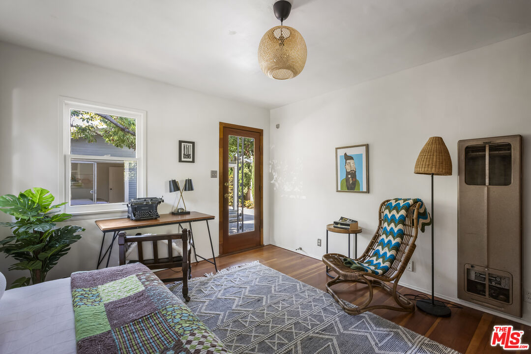 3865 Brunswick Avenue Los Angeles, CA 90039 - Photo 35 of 44 a view of a workspace room with furniture and wooden floor