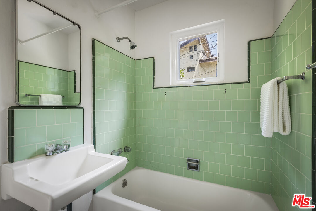 3865 Brunswick Avenue Los Angeles, CA 90039 - Photo 39 of 44 a bathroom with a sink a toilet and shower