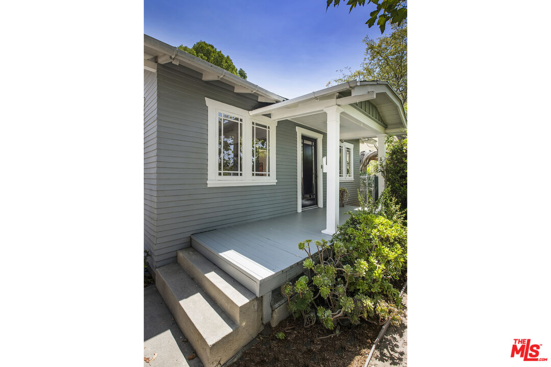 3865 Brunswick Avenue Los Angeles, CA 90039 - Photo 4 of 44 a view of a house with a small yard and floor to ceiling window