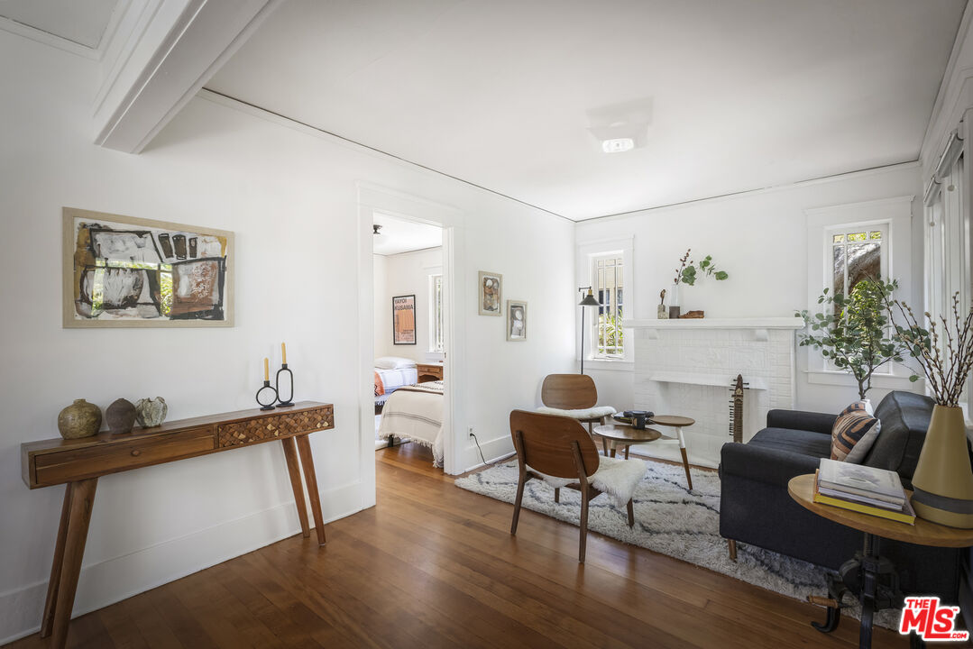 3865 Brunswick Avenue Los Angeles, CA 90039 - Photo 7 of 44 a living room with furniture a rug and a painting on the wall