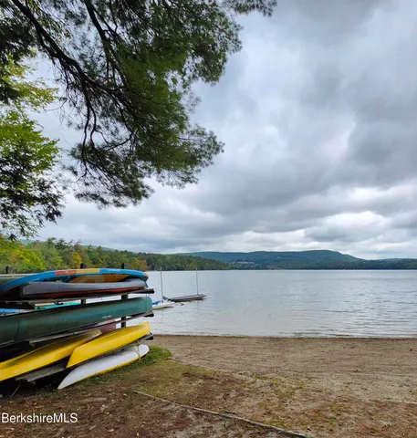 a view of a lake with houses in the back