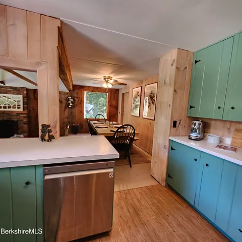 a kitchen with a sink appliances and cabinets