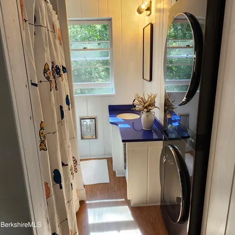 a view of living room with furniture and a window