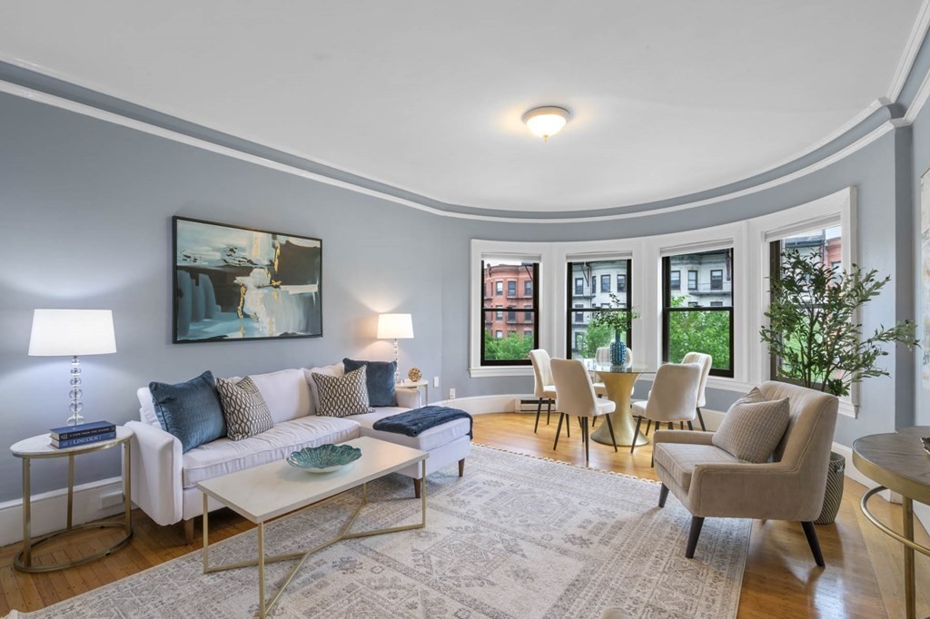 857 Beacon Street, Unit 34 Boston, MA 02215 - Photo 1 of 26 a living room with furniture and a large window