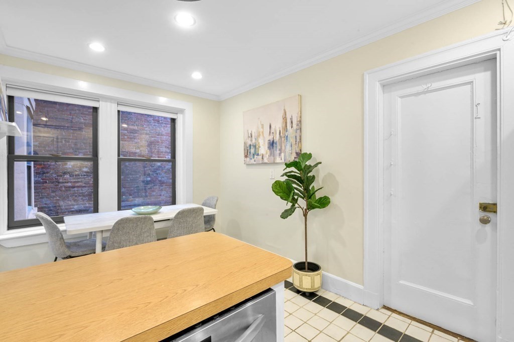 857 Beacon Street, Unit 34 Boston, MA 02215 - Photo 14 of 26 a bed room with a bed and a potted plant