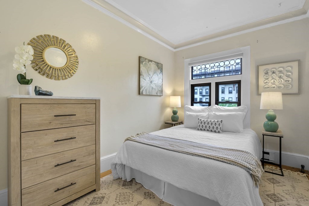 857 Beacon Street, Unit 34 Boston, MA 02215 - Photo 15 of 26 a bedroom with a bed and painting on the wall