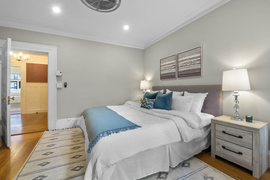 857 Beacon Street, Unit 34 Boston, MA 02215 - Photo 19 of 26 a bedroom with a bed and a night stand