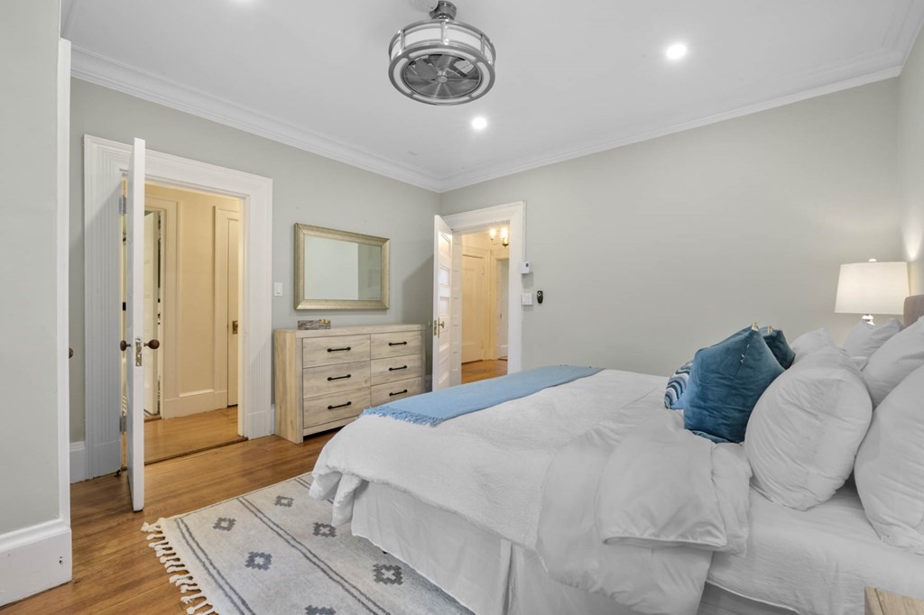 857 Beacon Street, Unit 34 Boston, MA 02215 - Photo 20 of 26 a bedroom with a bed and a view of bathroom