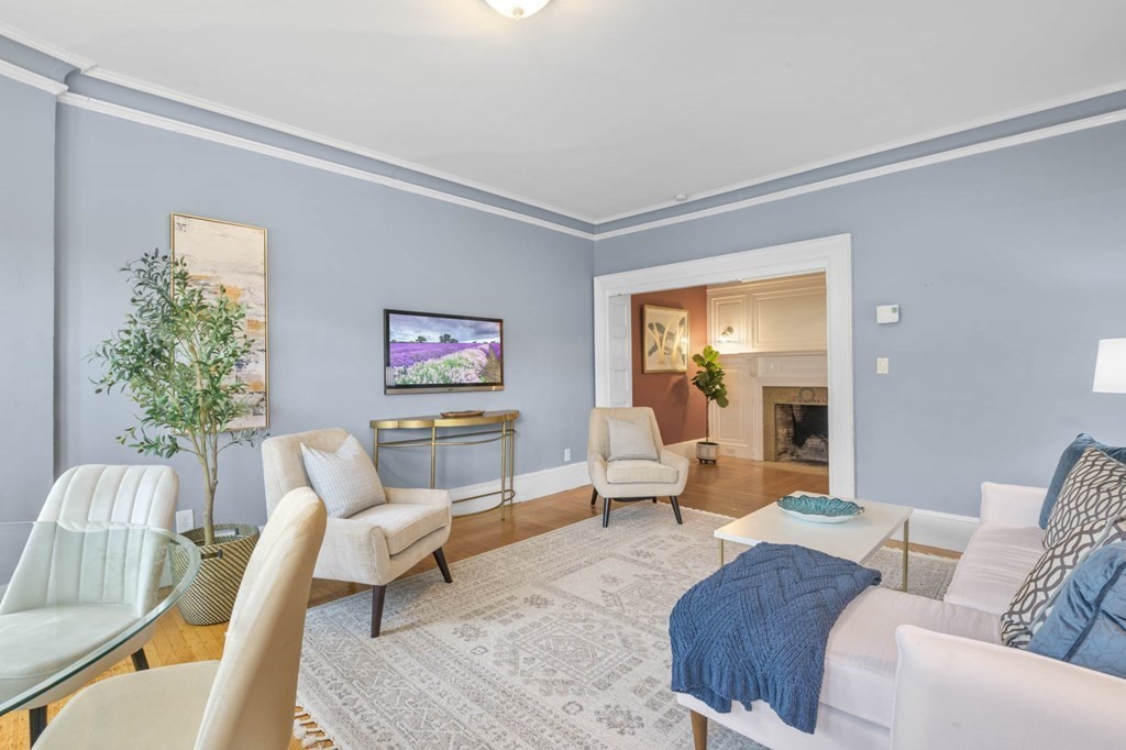 857 Beacon Street, Unit 34 Boston, MA 02215 - Photo 2 of 26 a living room with furniture and a large window