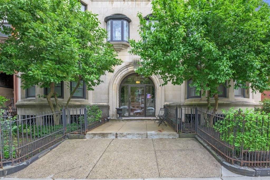 857 Beacon Street, Unit 34 Boston, MA 02215 - Photo 22 of 26 a front view of a house with a garden