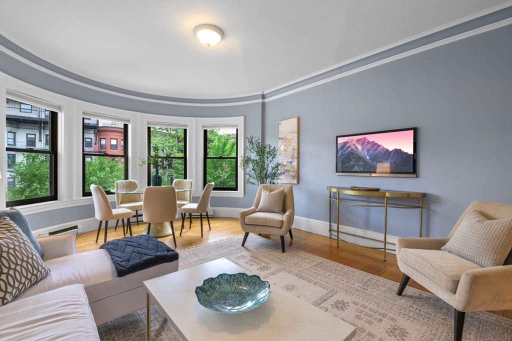 857 Beacon Street, Unit 34 Boston, MA 02215 - Photo 3 of 26 a living room with furniture and a flat screen tv