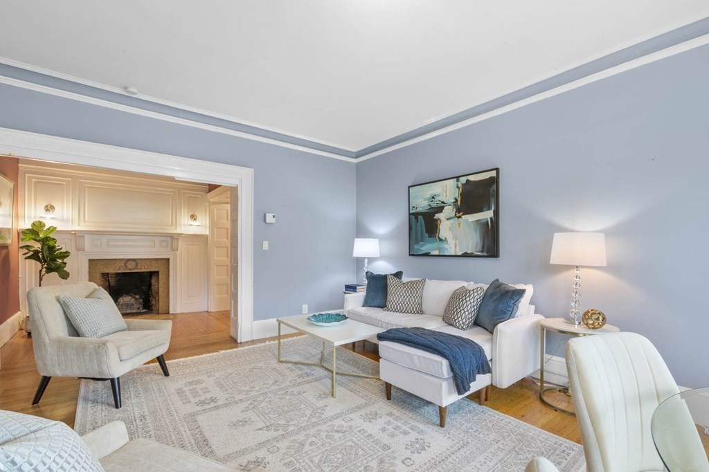 857 Beacon Street, Unit 34 Boston, MA 02215 - Photo 4 of 26 a living room with furniture and a fireplace