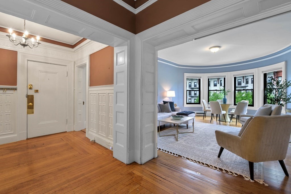 857 Beacon Street, Unit 34 Boston, MA 02215 - Photo 5 of 26 a living room with furniture and a wooden floor