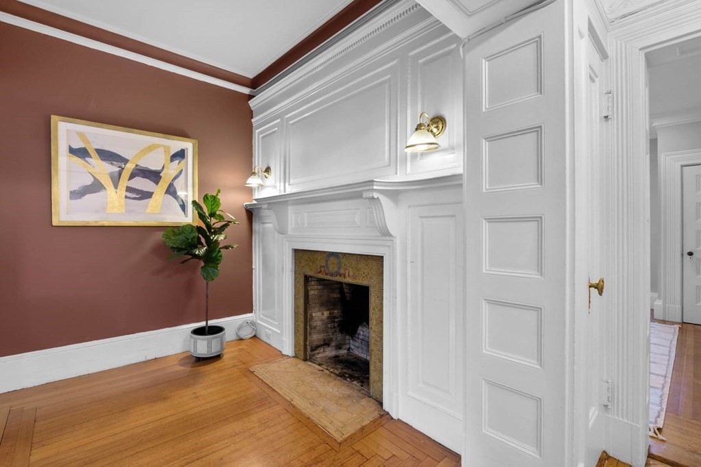 857 Beacon Street, Unit 34 Boston, MA 02215 - Photo 8 of 26 a living room with furniture and a fireplace