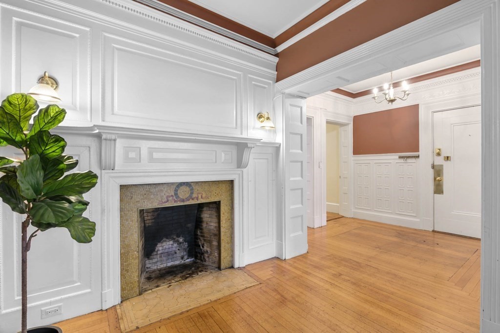 857 Beacon Street, Unit 34 Boston, MA 02215 - Photo 9 of 26 a living room with a fireplace
