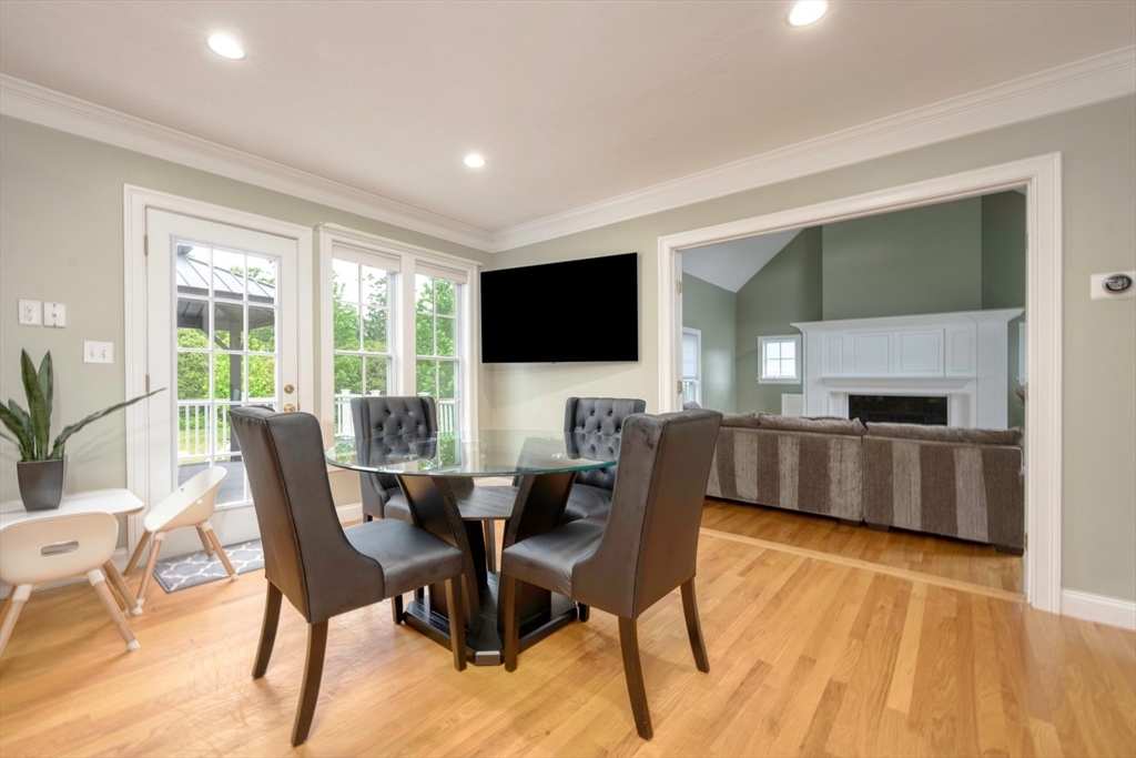 182 Jean Carol Road Abington, MA 02351 - Photo 12 of 38 a view of a dining room with furniture and a flat screen tv