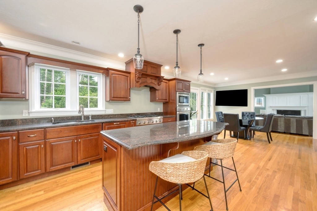182 Jean Carol Road Abington, MA 02351 - Photo 14 of 38 a kitchen with stainless steel appliances granite countertop a sink and cabinets