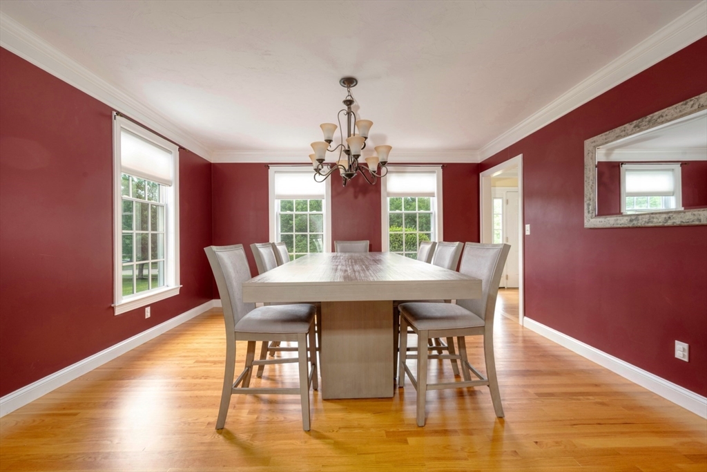 182 Jean Carol Road Abington, MA 02351 - Photo 15 of 38 a view of a dining room with furniture window and wooden floor