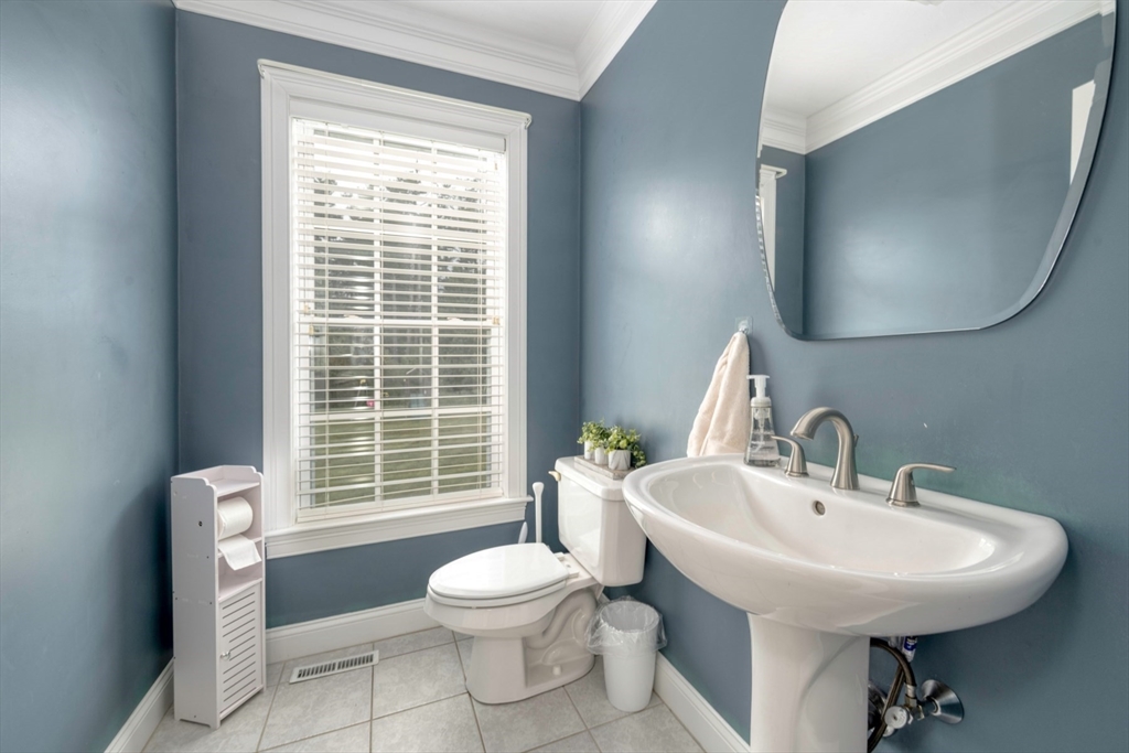 182 Jean Carol Road Abington, MA 02351 - Photo 18 of 38 a bathroom with a sink a toilet and a mirror