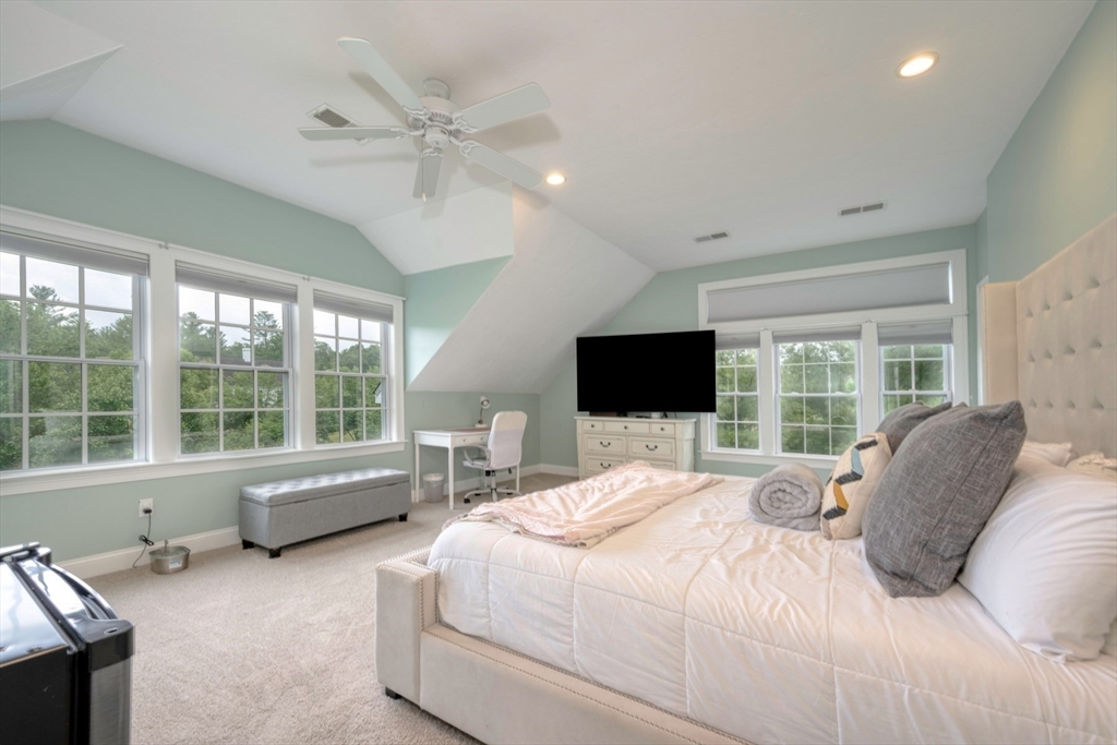 182 Jean Carol Road Abington, MA 02351 - Photo 21 of 38 a bedroom with a bed television and a large window