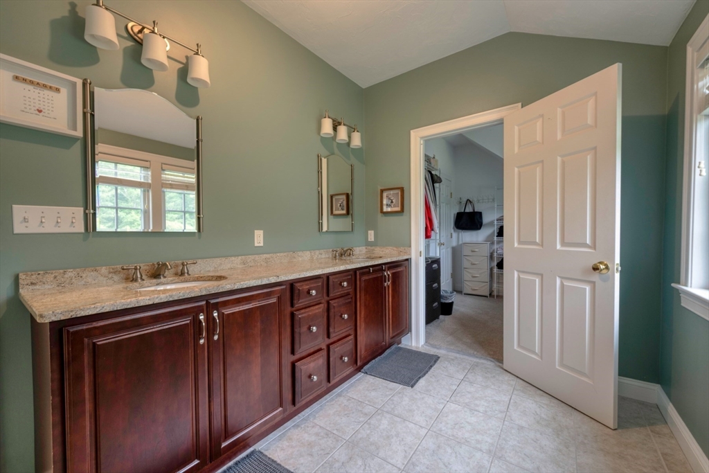 182 Jean Carol Road Abington, MA 02351 - Photo 22 of 38 a spacious bathroom with a double vanity sink and mirror