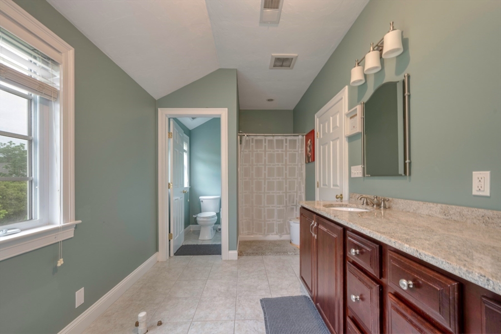 182 Jean Carol Road Abington, MA 02351 - Photo 23 of 38 a bathroom with a granite countertop sink and a mirror