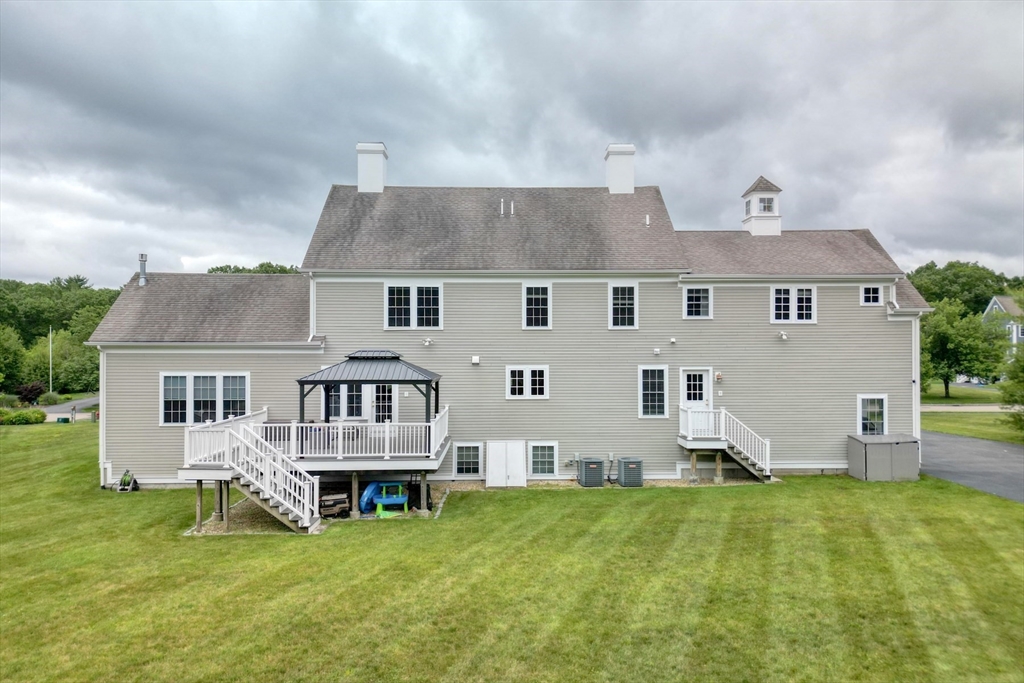 182 Jean Carol Road Abington, MA 02351 - Photo 4 of 38 an aerial view of a house with a garden