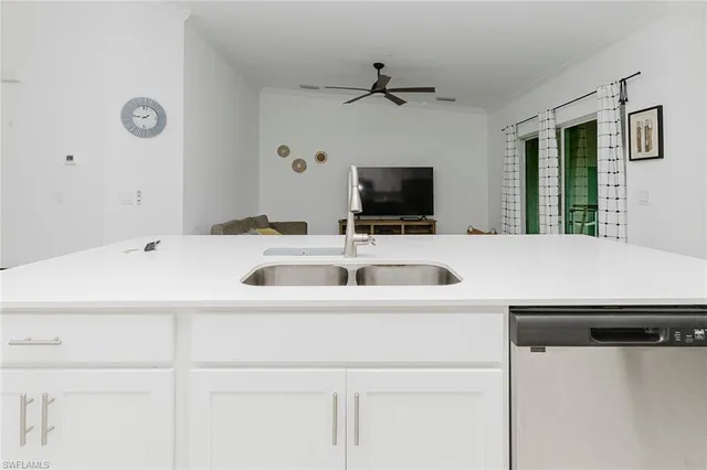 a kitchen with a sink and a refrigerator