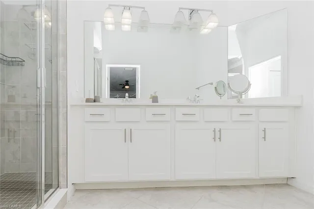 a bathroom with a sink and mirror