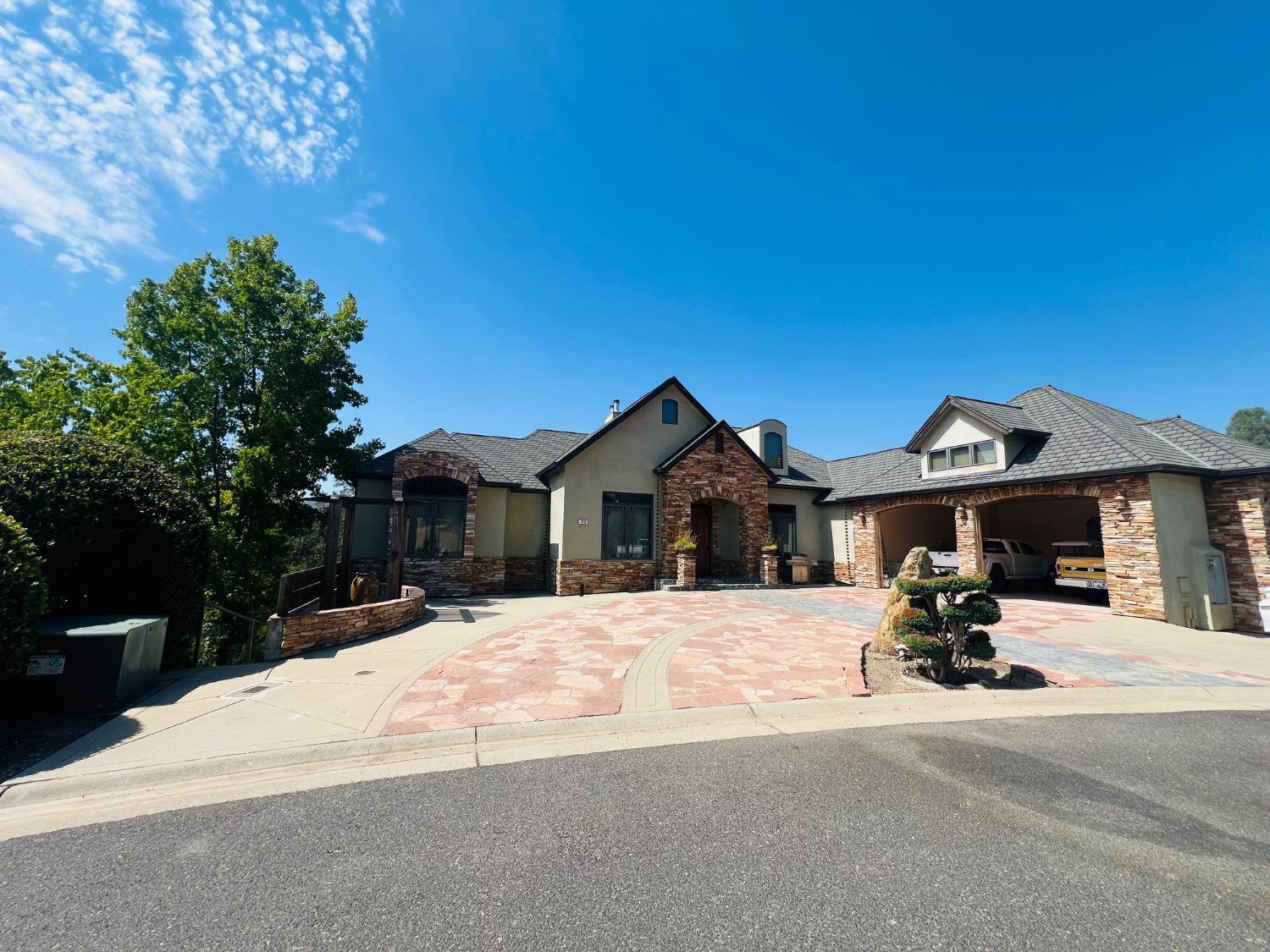 a view of a house with a yard covered in snow