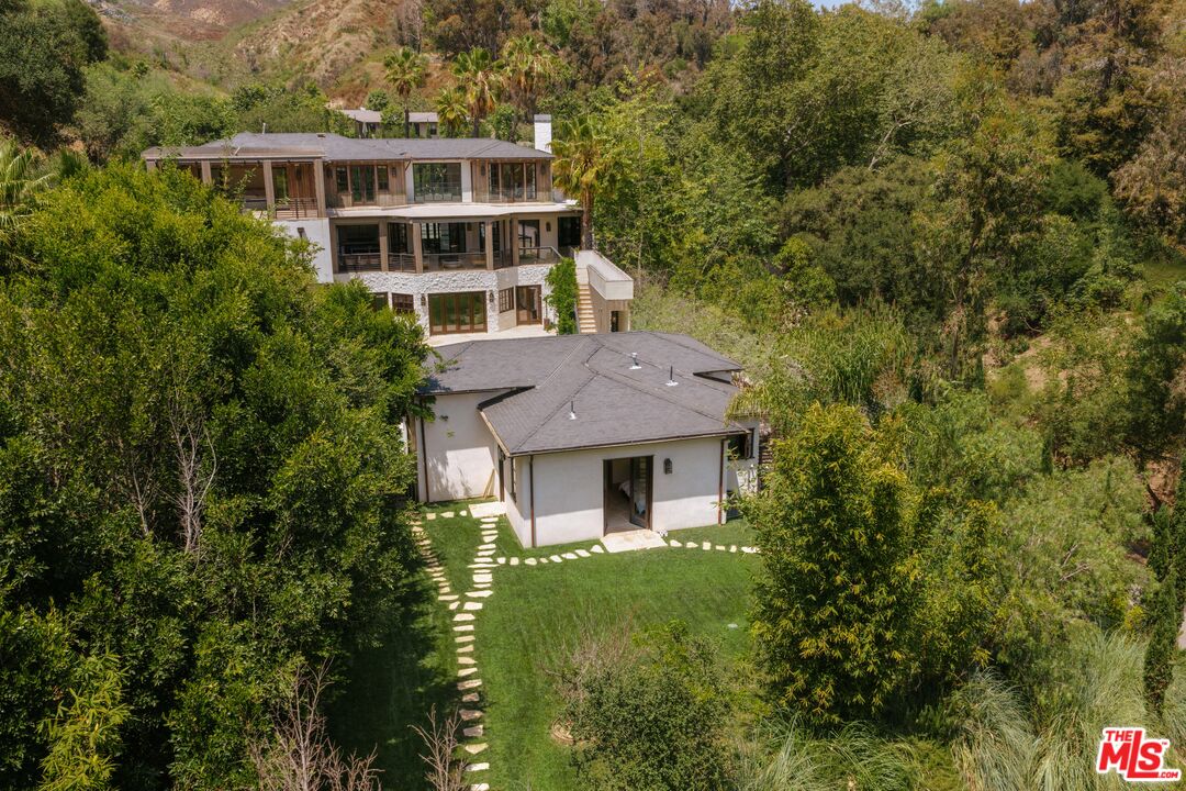1105 Rivas Canyon Road Pacific Palisades, CA 90272 - Photo 9 of 49 a house view with a garden space