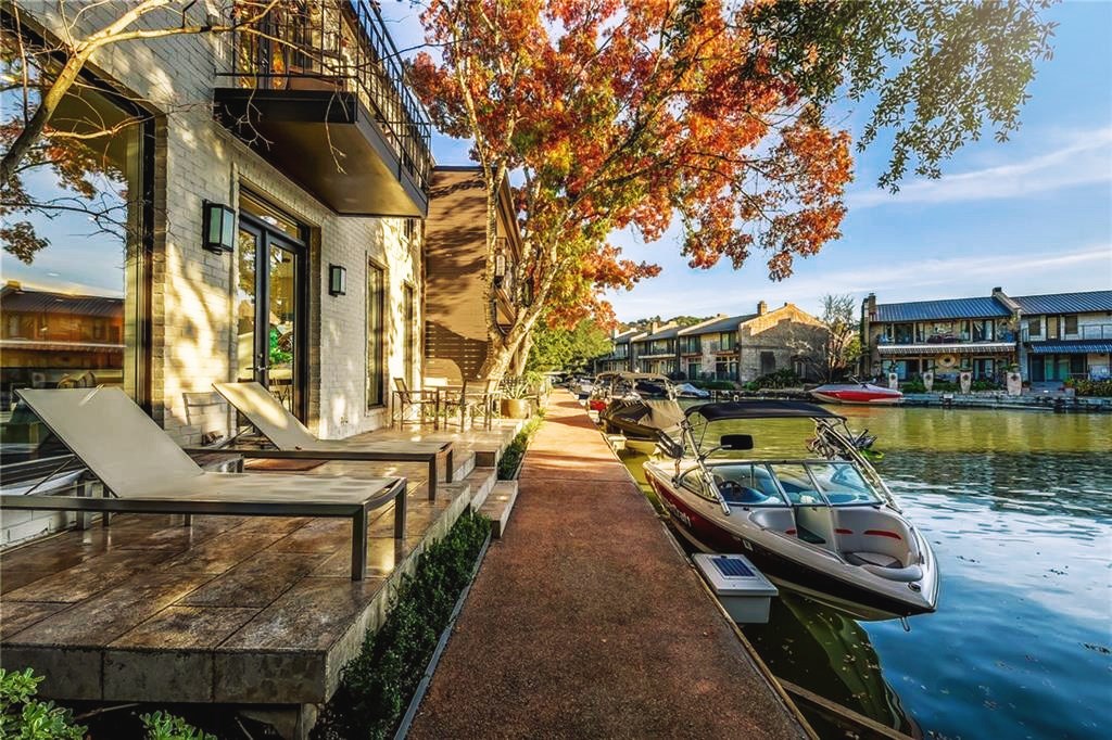 2453 Westlake Drive Austin, TX 78746 - Photo 1 of 1 a view of swimming pool with chairs and wooden fence