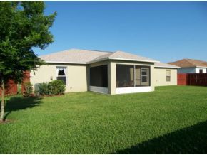 1010 Northeast Morgan Palm Bay, FL 32905 - Photo 12 of 12 a view of a house with a backyard