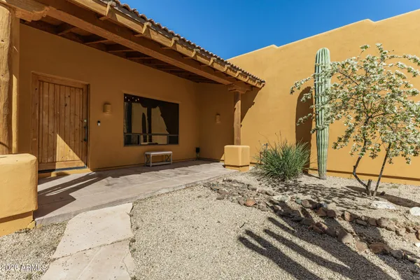 a living room with furniture ceiling fan and a window