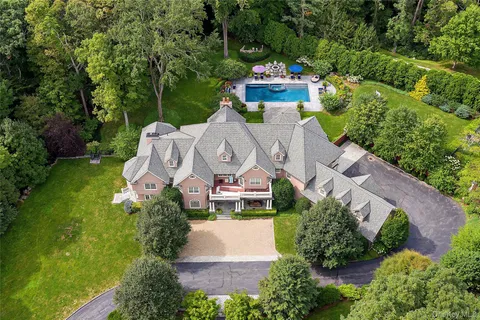 an aerial view of a house with outdoor space pool patio and outdoor seating